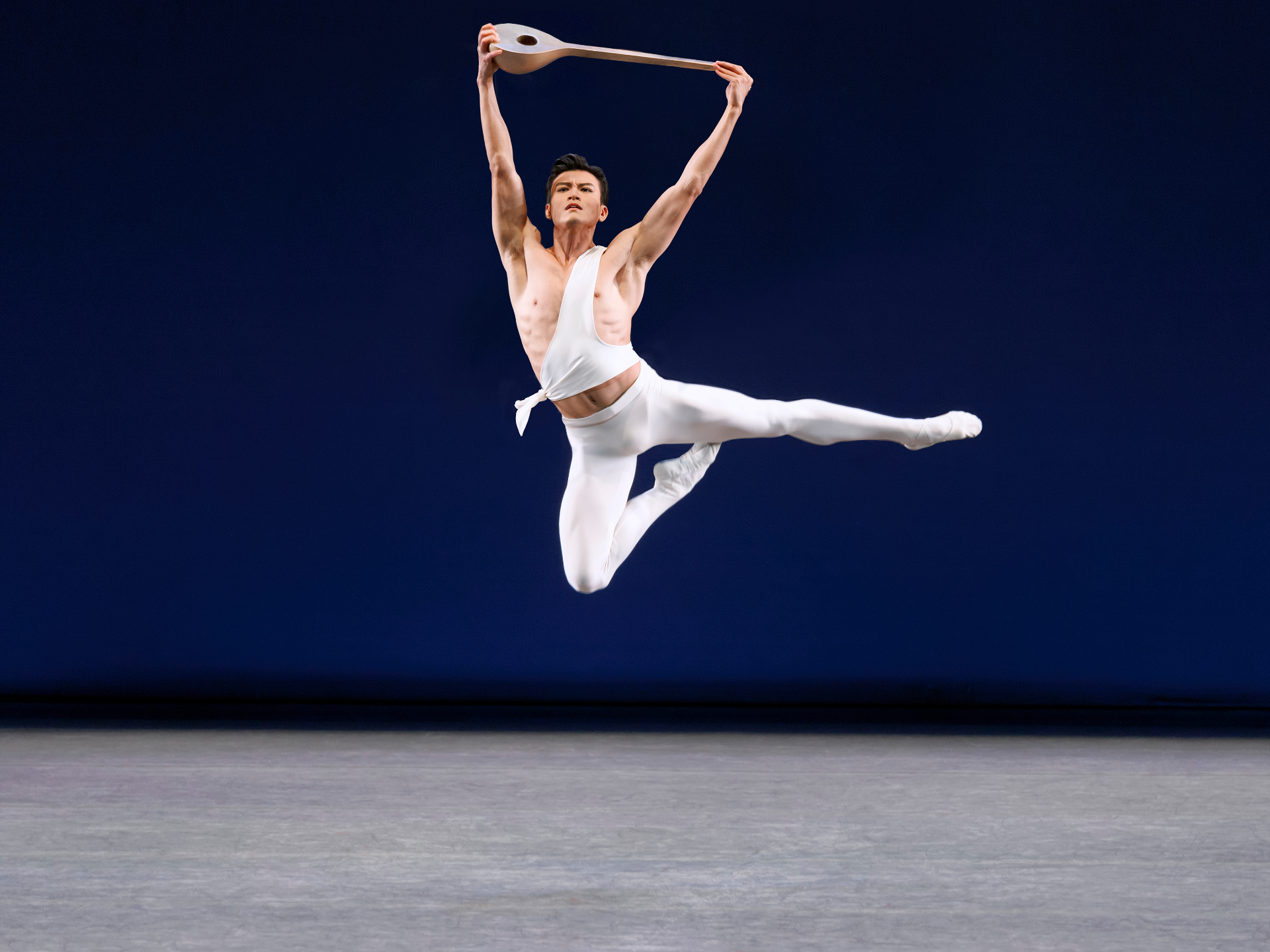 Apollo series — Apollo — soaring leap holding the lute aloft against deep blue