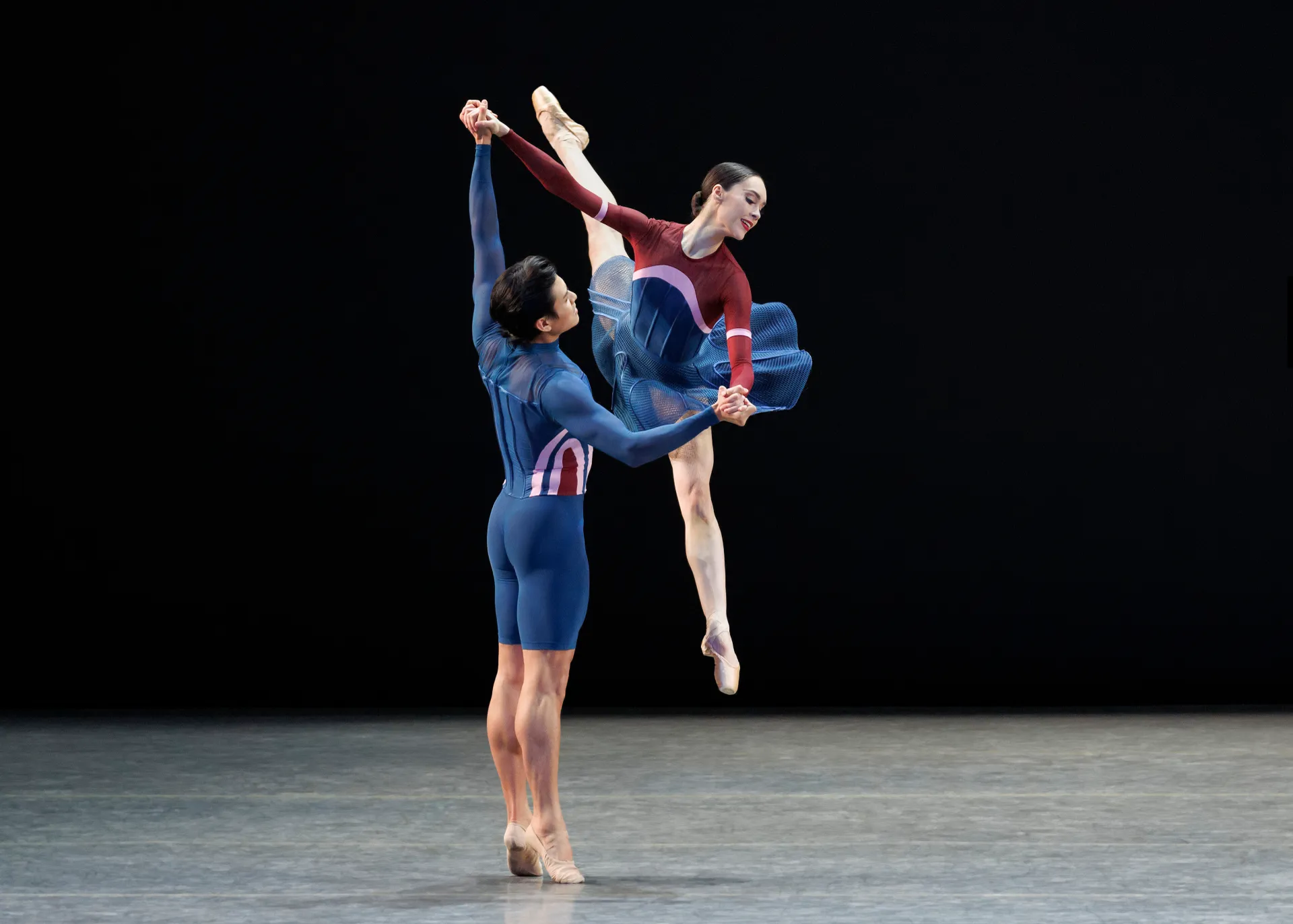 Wind Up series — Wind Up — partnered développé with ballerina in red and burgundy