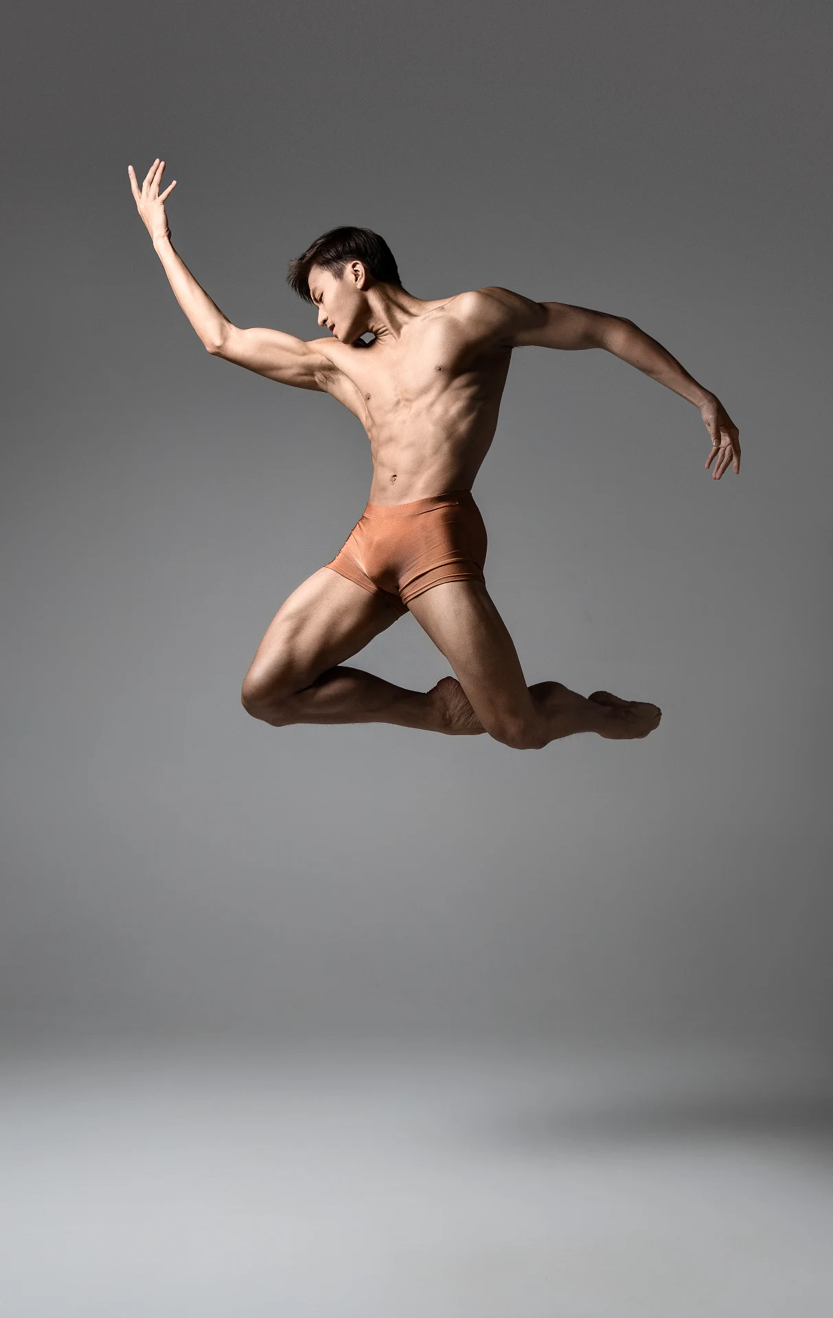 Chun Wai Chan — studio kneeling reach